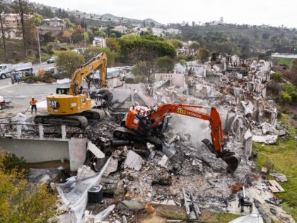 PACIFIC PALISADES, CA - APRIL 24: Excavators clean up the first home at the Vista del Mar