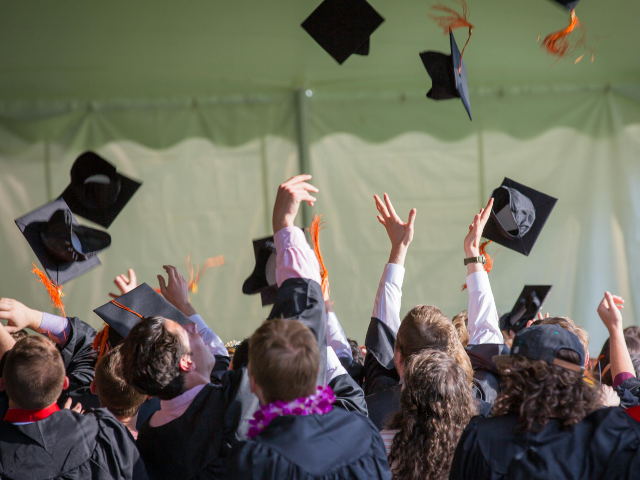 People Graduating Cap and Gown