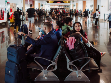 People Waiting in Departure Gate Waiting Area Airport