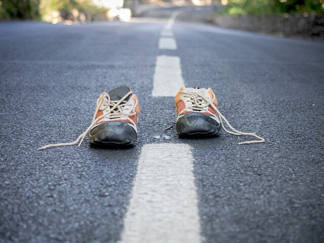 Pair of sneakers on the road