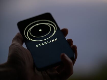 The Starlink logo is displayed on a mobile phone in this photo illustration in Brussels, B