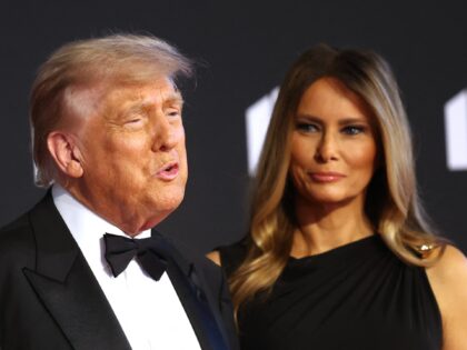 US President Donald Trump (L) and First Lady Melania Trump arrive to attend the opening ni