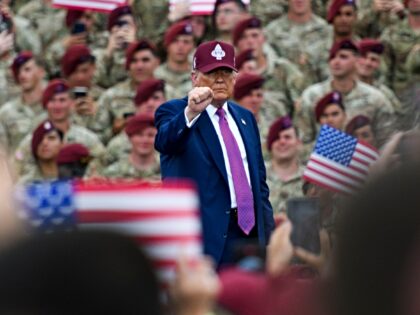 FORT BRAGG, NORTH CAROLINA - JUNE 10: U.S. President Donald Trump pumps his fist to the cr