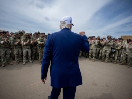 President Donald Trump speaks with members of the military demonstration at Fort Bragg, No