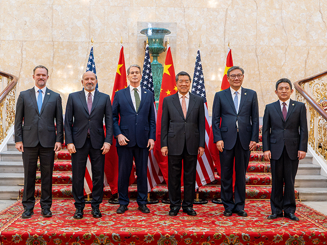 U.S. and China delegations pose for a photo during trade talks at Lancaster House in Londo