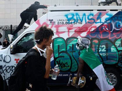 Alleged Agitators Seen Handing Out Bionic Face Shields to L.A. Protesters