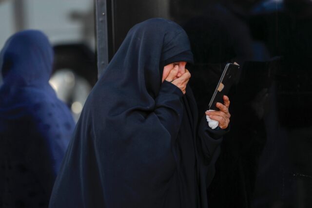 An Iranian woman in the Iraqi town of Ayn Tamr weeps after receiving word that a relative