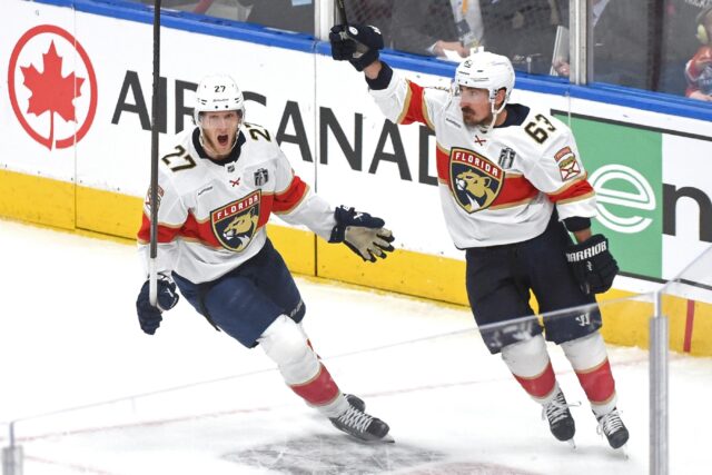 Brad Marchand of the Florida Panthers celebrates a goal with teammate Eetu Luostarinen in