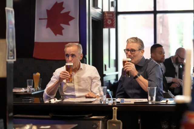 British Prime Minister Keir Starmer (R) and Canadian Prime Minister Mark Carney have a bee