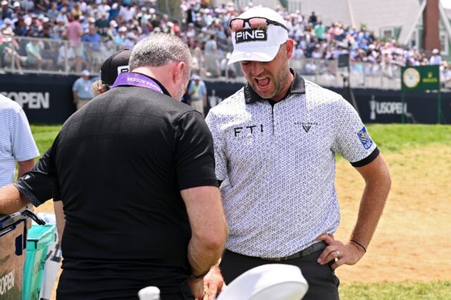 Corey Conners getting treatment on his right arm at the 12th tee in the third round of the