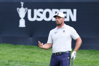 Defending champion Bryson DeChambeau of the United States reacts during a practice round a