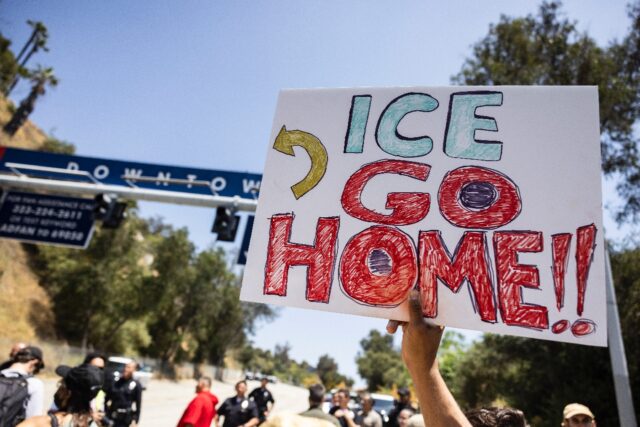 Demonstrators gathered near an entrance at Dodgers Stadium to protest any possible use as