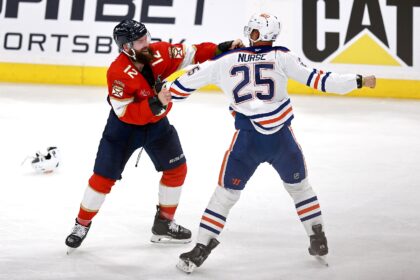 Florida's Jonah Gadjovich fights with Edmonton's Darnell Nurse during the third quarter of