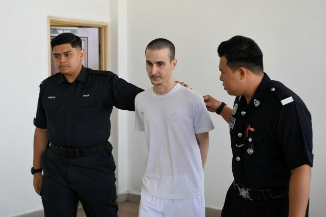 Frenchman Tom Felix (C) is accused of drug possession and trafficking, charges which can c
