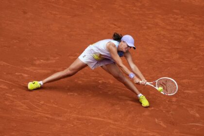 Iga Swiatek fought to keep her title defence alive at Roland Garros
