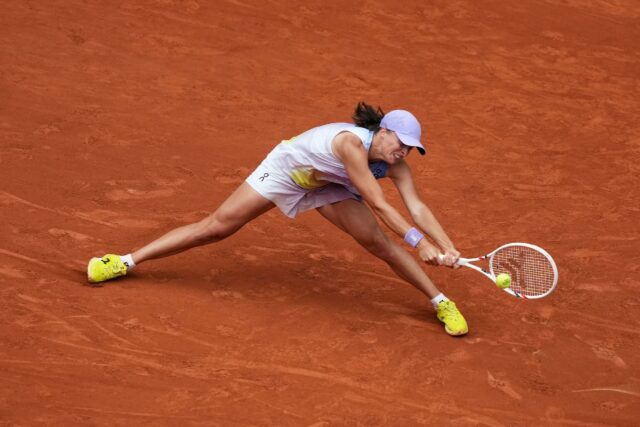 Iga Swiatek fought to keep her title defence alive at Roland Garros