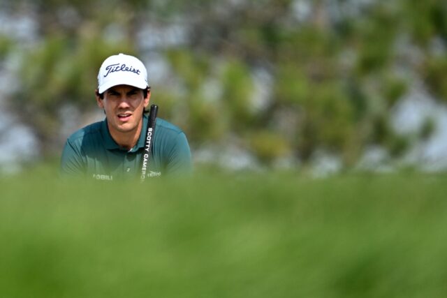 Italian Matteo Manassero lines up a putt on the way to a share of the third-round lead in
