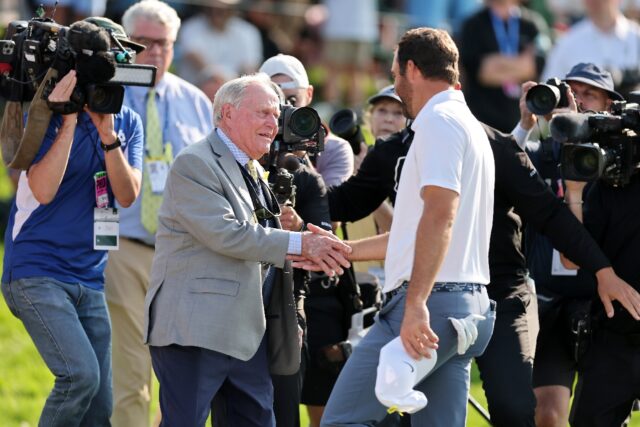 Jack Nicklaus, at left shaking hands with top-ranked Scottie Scheffler at the PGA Memorial