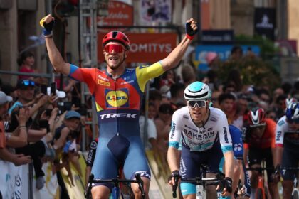 Jonathan Milan (L) celebrates victory on stage two of the Criterium du Dauphine
