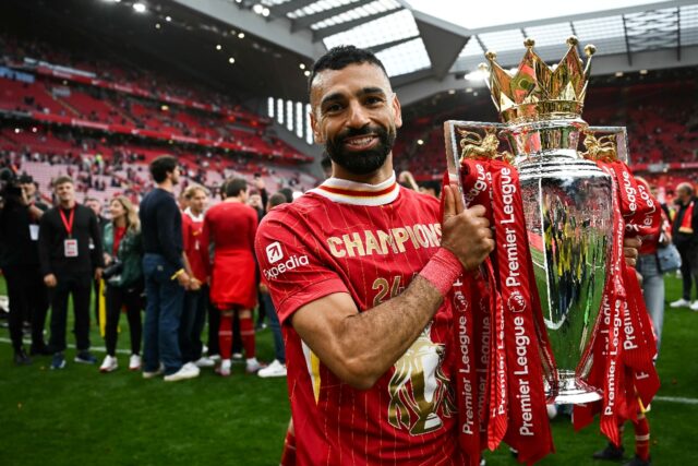 Liverpool's Egyptian striker Mohamed Salah celebrates with the Premier League trophy
