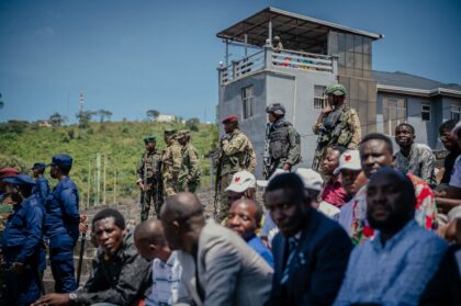 M23 rfighters stand guard during a service organized by rebels' administration at a s