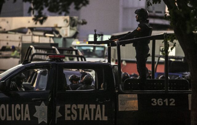 Mexican police on patrol in Sinaloa state, which has been shaken by cartel infighting