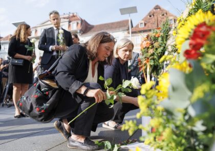 Mourners cried, hugged and left flowers, candles and letters to the victims in Graz
