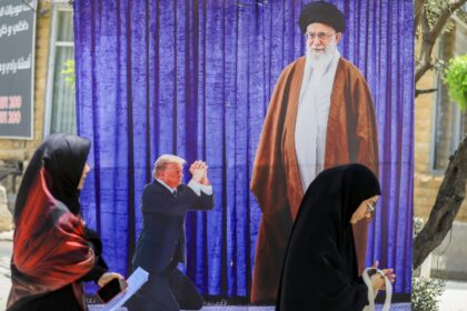 A poster depicting US President Donald Trump prostrating in front of Iran's Ayatollah