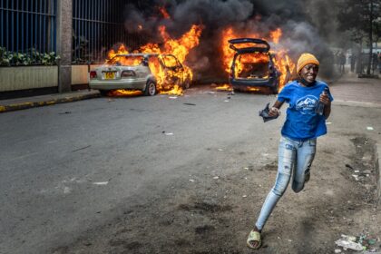 Protesters marched on parliament on Thursday, some throwing stones and police firing tear