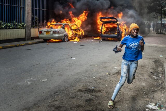 Protesters marched on parliament on Thursday, some throwing stones and police firing tear