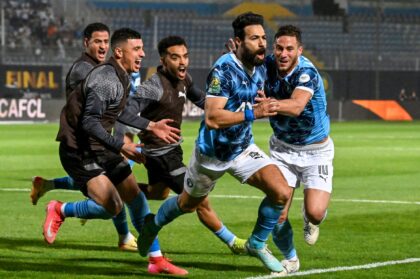 Pyramids defender Ahmed Samy (2R) celebrates scoring against Mamelodi Sundowns in the CAF
