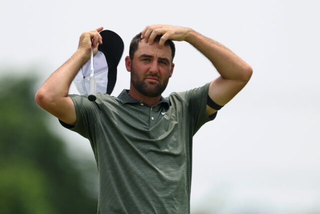World number one Scottie Scheffler watches play during the second round of the US Open, wh