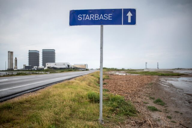 A sign pointing towards Starbase is seen on the road outside Brownsville, Texas