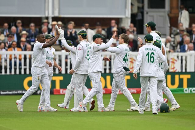 South Africa's Kagiso Rabada (L) celebrates with team-mates after dismissing Australia's C