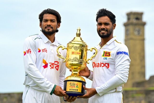 Sri Lanka's captain Dhananjaya de Silva (R) and his Bangladesh counterpart Najmul Hossain
