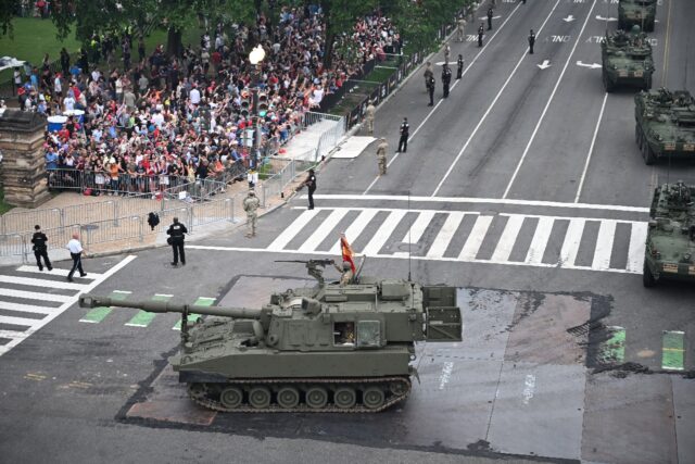 Troops and military hardware from different eras of US history passed by