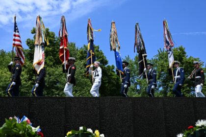 A US military color guard participates at a service at the Vietnam Veterans Memorial on Me