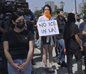 Body found, 100-plus arrested amid violent LA protests of ICE raids