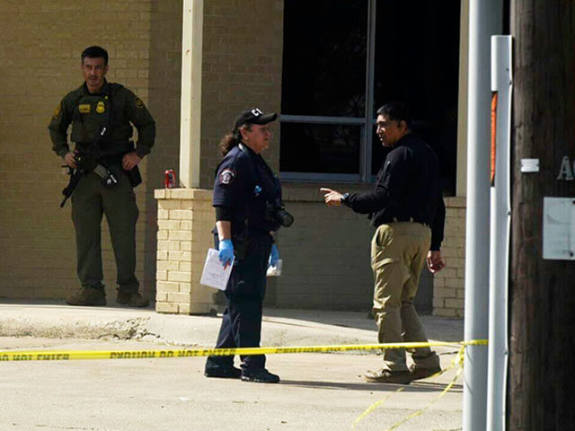 Officials work the scene of a shooting at a Border Patrol facility in McAllen, Texas, Mond