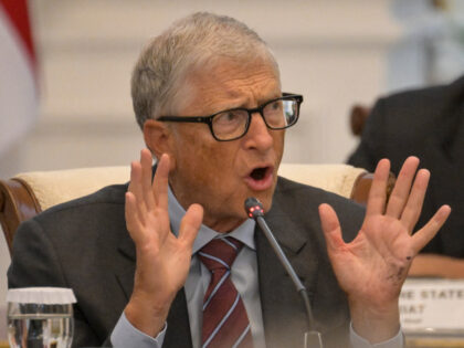 Microsoft founder and philanthropist Bill Gates gestures during a meeting with Indonesian