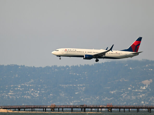 Delta Airlines plane landing at San Francisco International Airport A Delta Airlines plane lands at San Francisco International Airport (SFO) in San Francisco