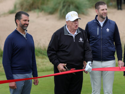 U.S. President Donald Trump cuts the ribbon next to Donald Trump Jr. (L) Eric Trump (2nd R
