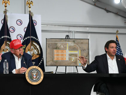 Florida Governor Ron DeSantis (R) speaks alongside US President President Donald Trump dur