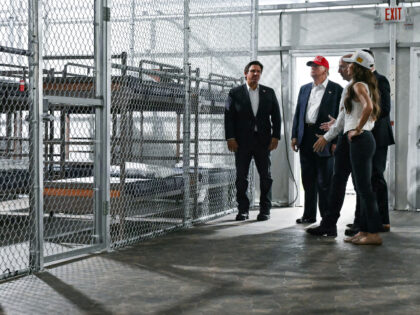 President President Donald Trump (2L), Florida Governor Ron DeSantis (L), and Secretary of