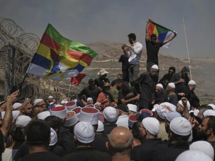 Druze from Syria and Israel protest on the Israeli-Syrian border, in Majdal Shams in the I