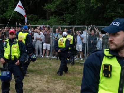 English police keep citizens fenced in