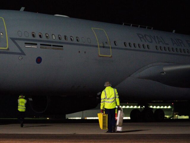 A British military transport aircraft flying passengers evacuated from Afghanistan lands a