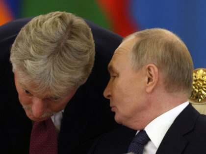 MOSCOW, RUSSIA - OCTOBER 8 (RUSSIA OUT) Russian President Vladimir Putin (R) talks to Pres