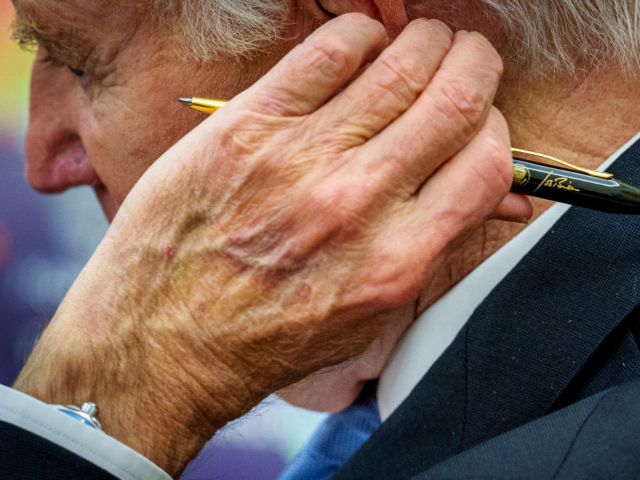 GettyImages-2193232501 WASHINGTON, DC - JANUARY 13: U.S. President Joe Biden holds a pen bearing his signature du