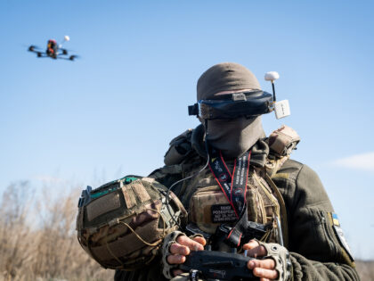 A Ukrainian soldier performs a trial with an FPV drone in the region of Kharkiv, Ukraine,